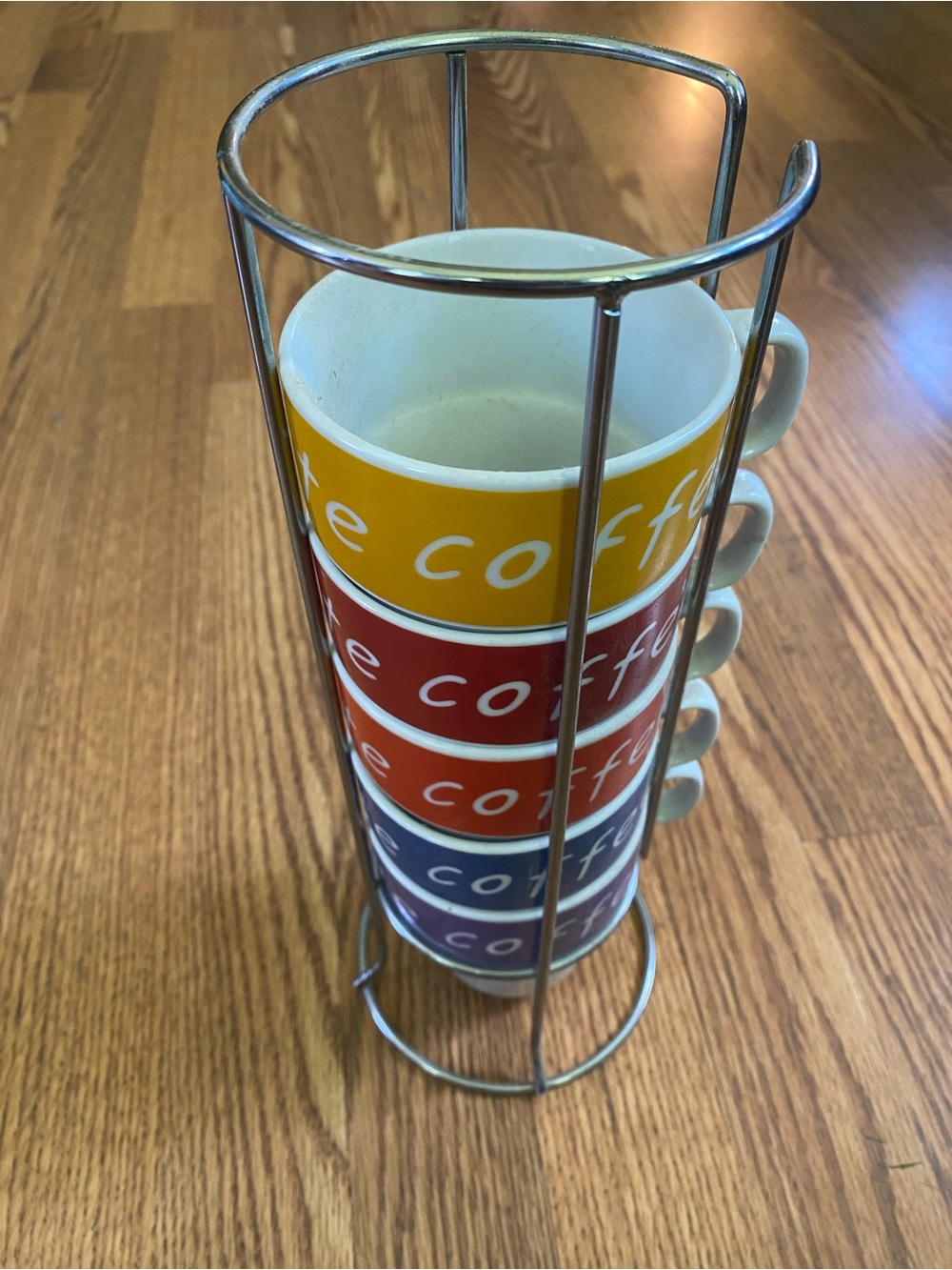 Stacked Coffee Mugs in Metal Rack